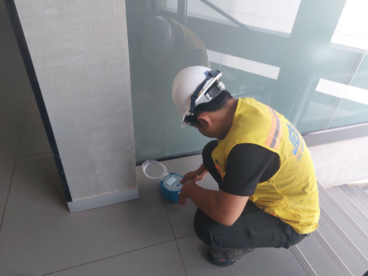 Civil engineer in Phnom Penh setting up vibration monitoring equipment